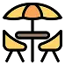 Icon of a patio dining set with two chairs and a table under an umbrella.