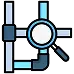 Icon of a magnifying glass inspecting intersecting blue and gray pipes, suggesting pipe inspection or plumbing analysis.