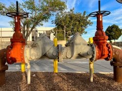 Water main pipe with back flow prevention and double block