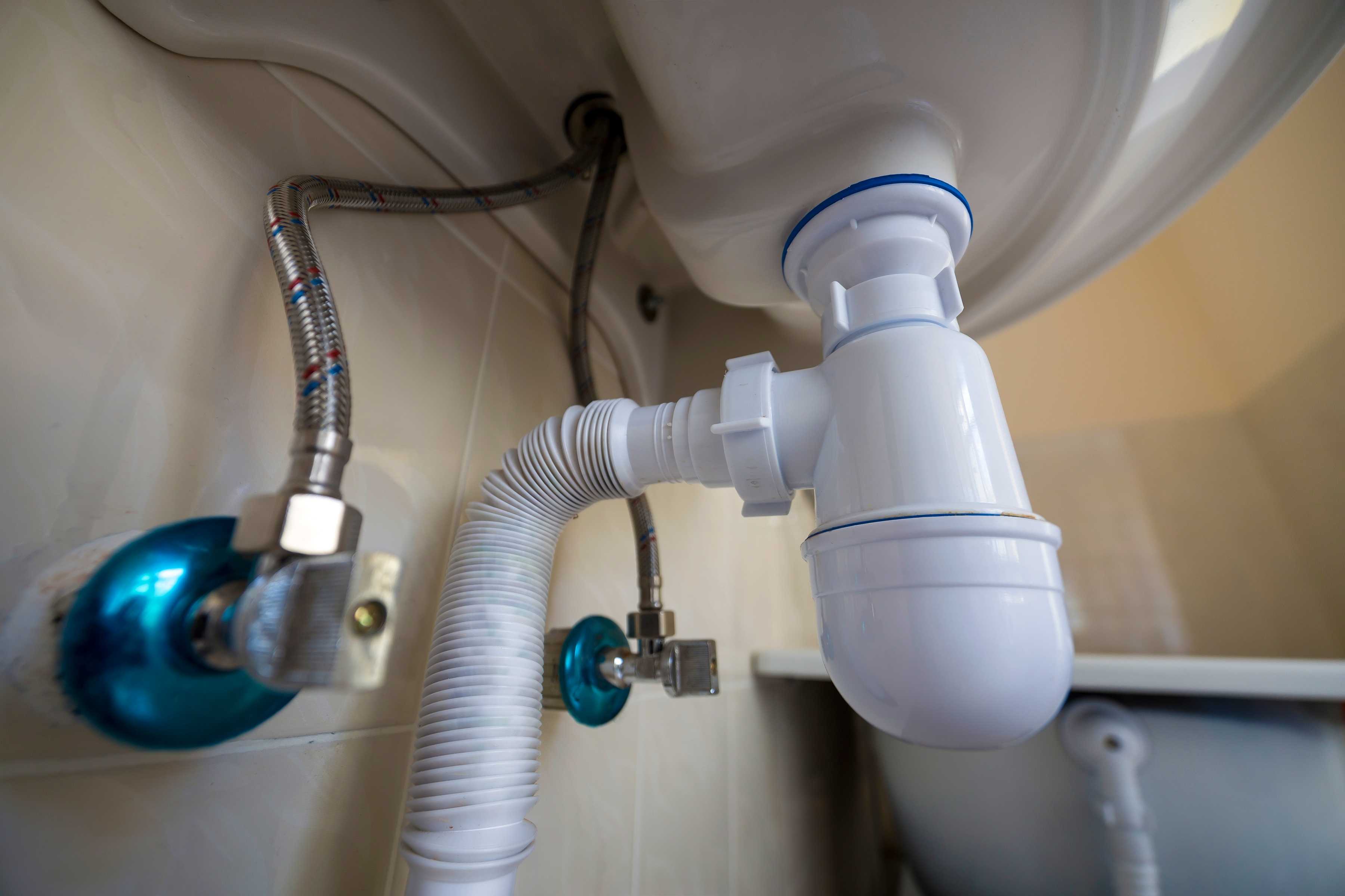 bottom view of new white washbasin sink connected