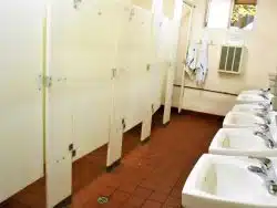 clean-public-restroom-with-white-sinks-and-partiti-2026-07-15-21-35-26-utc