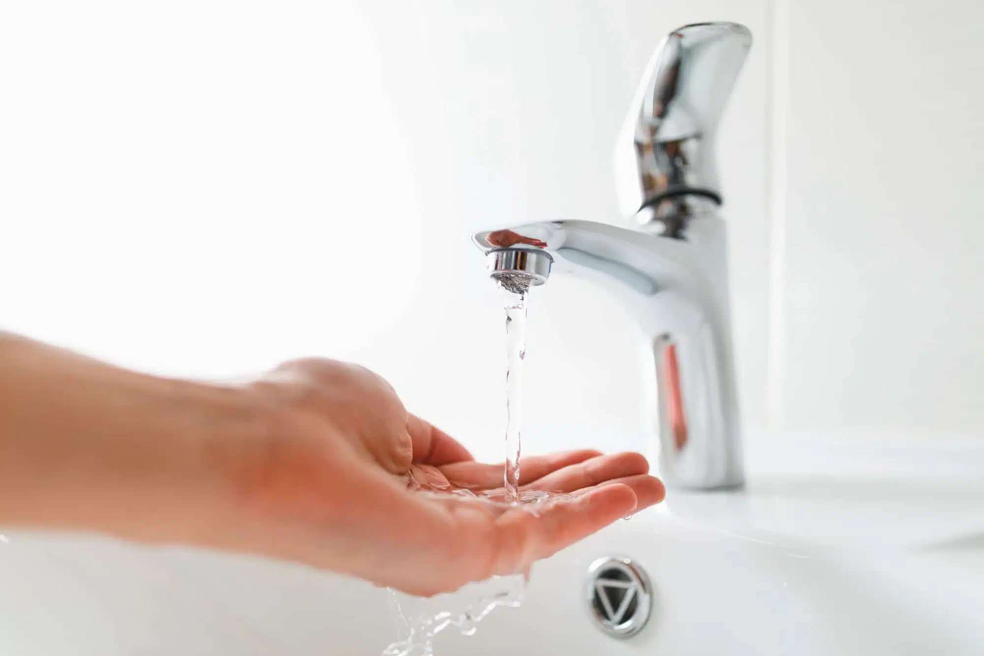 hand under faucet