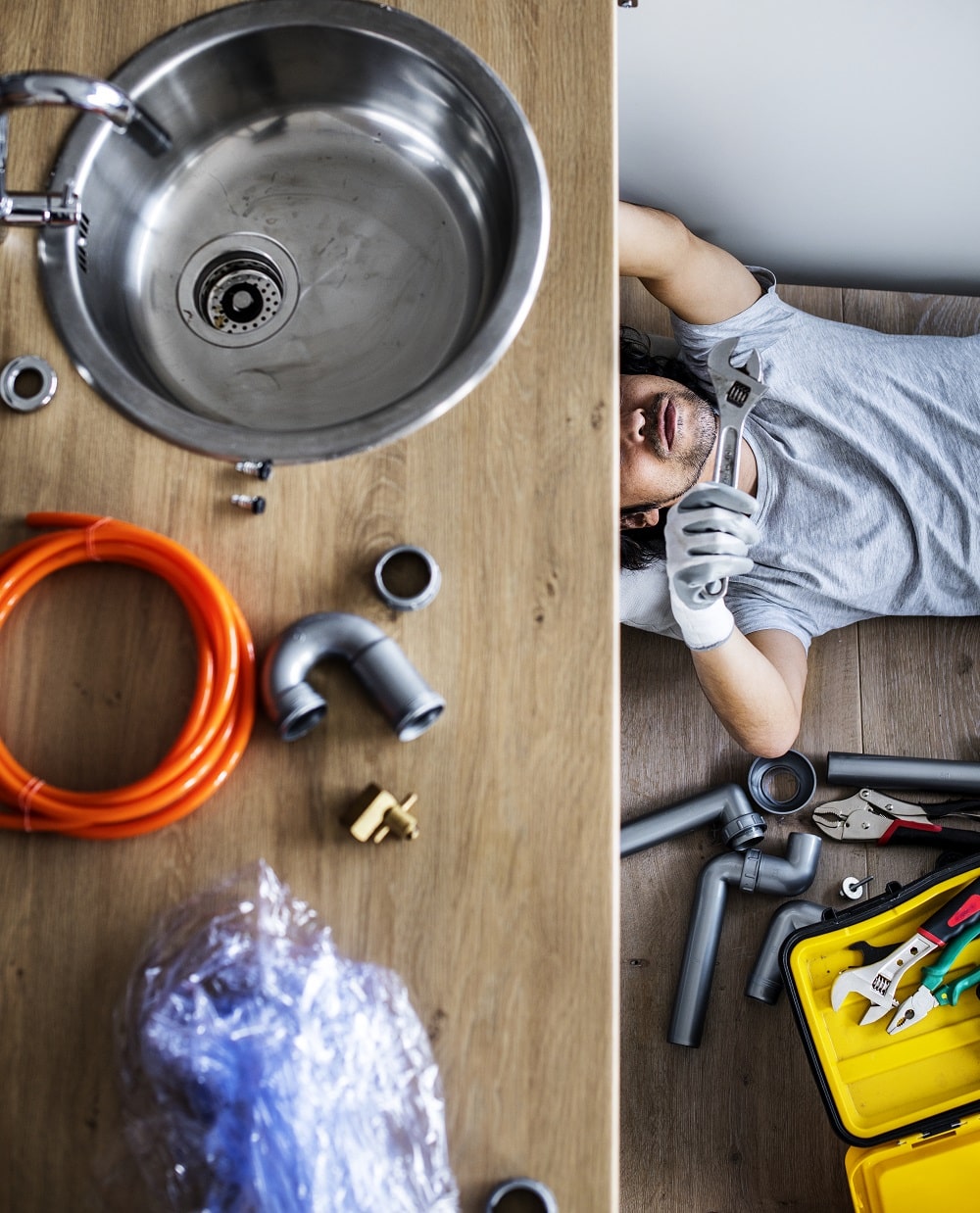 Man fixing kitchen sink
