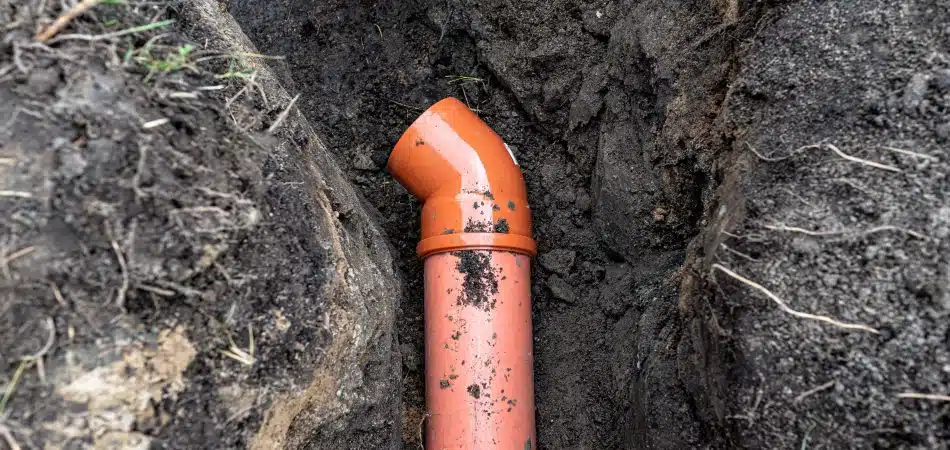 new drainage pipe installed in clay soil