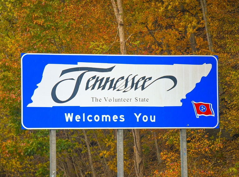 A blue roadside sign reading