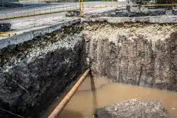 piping-exposed-in-deep-hole-in-asphalt-road-2026-01-06-09-45-02-utc