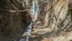 Old sewer pipe being removed and replaced with new piping