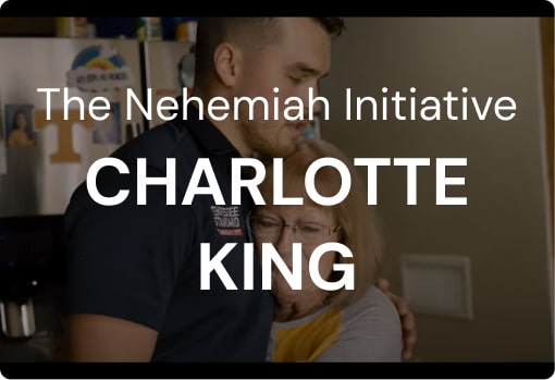 Kelton Balka, founder of Tennessee Standard Plumbing, embraces a woman in a kitchen. Text overlay reads: