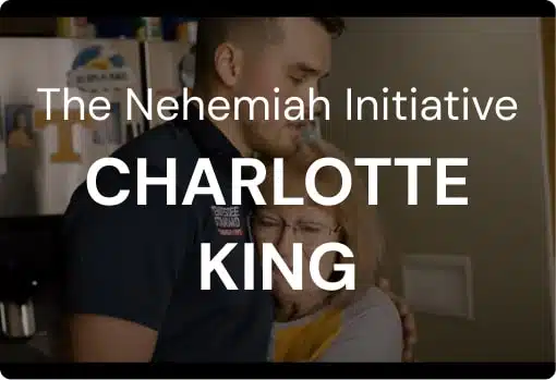 Kelton Balka, founder of Tennessee Standard Plumbing, embraces a woman in a kitchen. Text overlay reads: 
